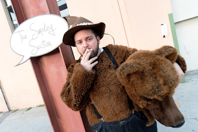 A costumed Smokey the Bear welcomed smokers to the smoking section.