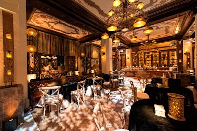 Animal-print fabrics, wood chairs, and metallic accents set the mood.