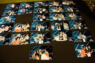 A photo booth allowed guests to take silly photos against an '80s-inspired yearbook-picture backdrop. A table featuring old-school photos and other items from the decade served as props for the images.