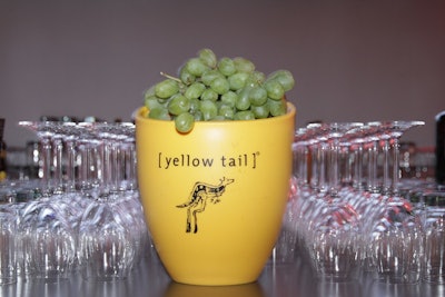 At the bar, a Yellow Tail wine bucket held clusters of grapes.