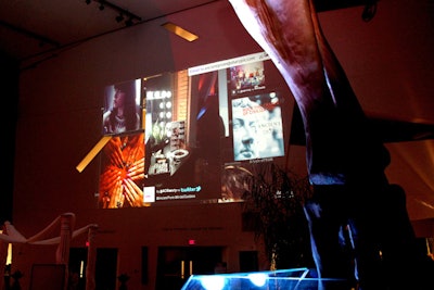 A projection screen showcased a live feed from the event's Twitter stream.