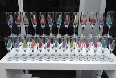 Colorful nail polish bottles filled champagne glasses at L'Oréal’s brunch planned by Joe Moller at the Viceroy EOS Restaurant in Miami.