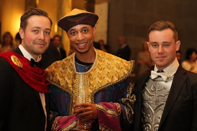 The invitation encouraged guests to 'channel your inner gladiator or goddess and dress to impress.' Gentlemen were asked to 'be daring!' and wear capes, faux fur, and body armor. Many guests embraced the sartorial challenge.