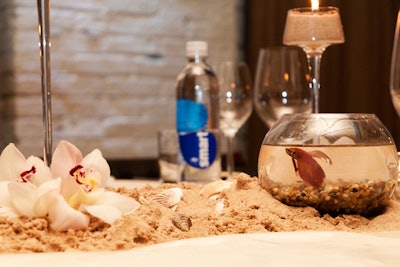 The Mint Agency used sand, shells, and bowls holding live fish as centerpieces at the September premiere dinner for Spring Breakers during the Toronto International Film Festival.