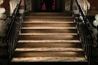 For consistent brand messaging, the event's organizers placed strips of Kate Young for Target carpeting over the venue's existing steps, which were side lit with spotlights for an extra bit of fashionable flair.
