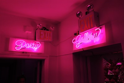 Much like the drink straws, pink neon signs directed guests to the different rooms of the party.