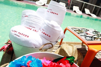 To kick off its summer-long partnership, eyewear brand Warby Parker hosted a summer pool party in June 2012 at the Standard in downtown Los Angeles. In addition to staffers pushing library-style book carts around the space as a way to get guests to try on the limited-edition shades, poolside tables also displayed the glasses alongside buckets of branded towels.