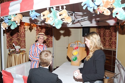 The cocktail reception had the look of a carnival midway, and guests could play games to win plush prizes.