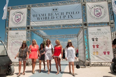 The entrance to the beachfront tournament included a schedule of events, a visual team roster, and the tournament hashtags.