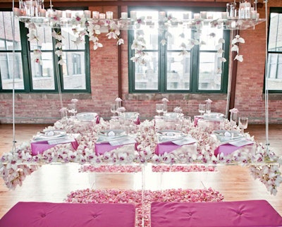 The event also showcased tabletops from different vendors. Ashland Addison Florist created a hanging table strewn with hundreds of pink and white orchids.