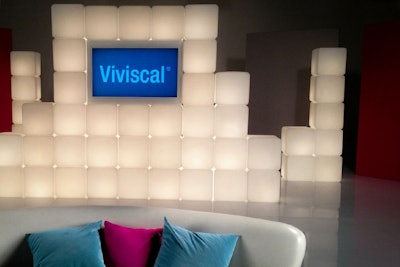 Lighted cubes, flat screens, sofa and complete set design for commercial at SiRReel Studios.