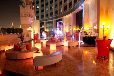 Modern furniture and lighted furniture on the terrace. Custom branded bar and DJ booth.