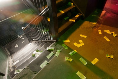 Fake money and foggy lighting led guests into the basement of the hotel. Chad Hudson Designs let the industrial ruggedness of the building speak for itself by keeping the entrance's decor to a minimum.