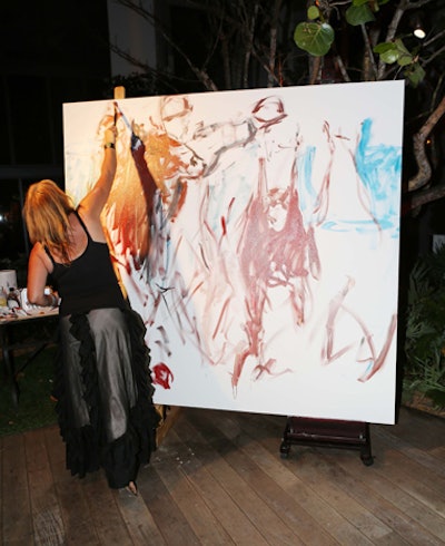 Artist Josee Nadeau worked on a polo-themed painting at a cocktail reception at W South Beach.