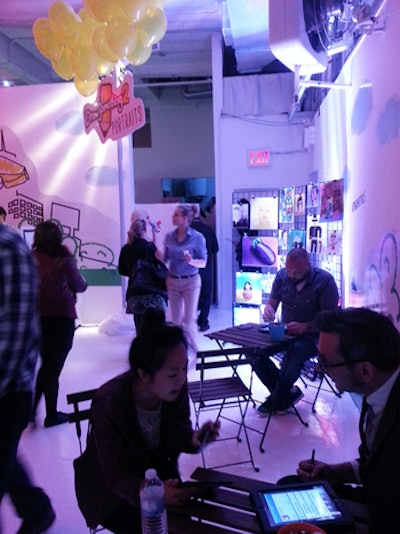 In another section, artists drew guest portraits on tablets using Draw Something 2.