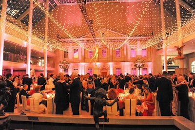 The dinner, housed in the museum's Charles Engelhard Court in the American Wing, took place under a canopy of 13,000 bare 14-watt lightbulbs. 'They could be dimmed to create a beautiful effect,' said event producer Raul Avila. Fluorescent pink Plexiglas covered the windows facing Central Park as the 800-plus guests took their seats. 'Lighting was the biggest focus of the American Wing this year,' Avila added. 'We wanted to keep it elegant and more couture, in a way, without taking away from the entrance and the after-party.'