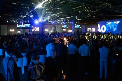 Screens wrapped around much of the presentation room, a converted loading dock that AgencyEA built out for the event.