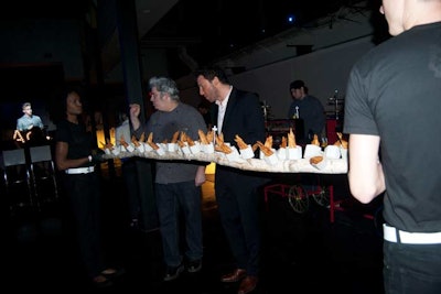 Another catering presentation had catering staffers carry a log with individual servings of fried potatoes. Chef Rocco DiSpirito, who presented his new show Now Eat This! Italy, sampled the food.
