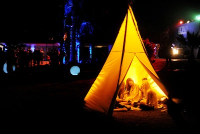 At the Hennessy V.S. Presents Details at Midnight event at Coachella, guests gathered in a tricked-out teepee.