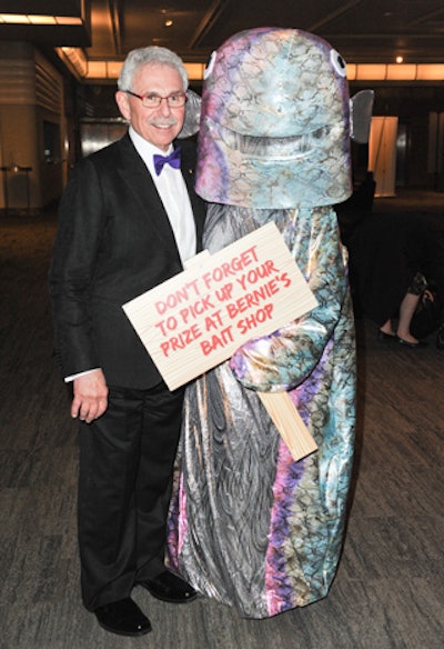 Event producers rented a fish costume from the Tickle Trunk. The scaly creature posed for photos with guests and held a sign that advertised the Bait Shop.
