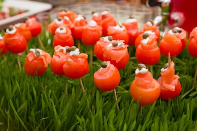 On the red appetizer cart, offerings included cherry tomatoes with smoked salmon, presented in a flower-like display.