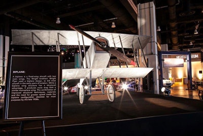 A model of the Wright brothers' biplane was the star of the the Smithsonian National Air and Space Museum section. Decor in the area featured metallic hues, and guests could try a flight simulator.