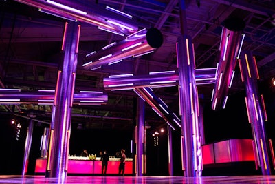 David Stark's design in the cocktail area included giant metallic tubes decorated with florescent lights that changed colors.