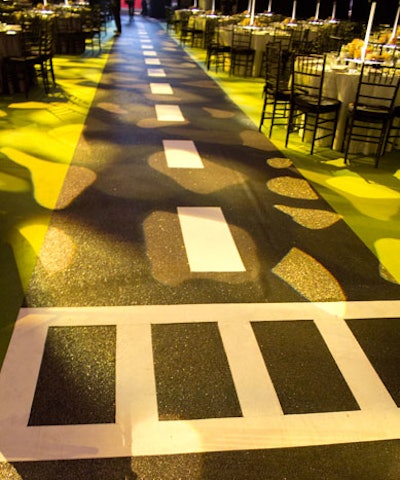 Befitting the Times Square theme, the aisles between dinner tables were designed like New York city streets, with glittery 'asphalt' and road markings.