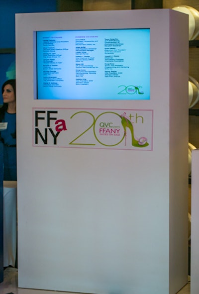 Digital signage provided information about the QVC Presents FFANY Shoes On Sale benefit. Nearly a dozen designers donated shoes for the auction.