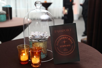In the reception area, bell jars covered succulents potted in small containers printed with maps. The evening's printed materials resembled passports, and sepia-hued candle holders let off an old-timey glow.