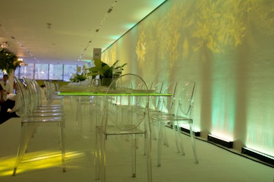 Lighting company Bentley Meeker projected images of greenery onto the museum's walls. Clear Victoria Ghost chairs provided by Taylor Creative Inc. added a modern edge to the look.
