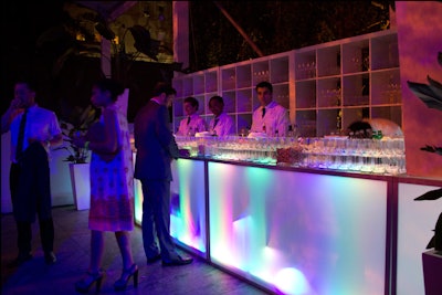 At the after-party, the previously plain white bar façades began glowing with a rainbow of colors. Taylor Creative Inc. provided the bars and highboys.
