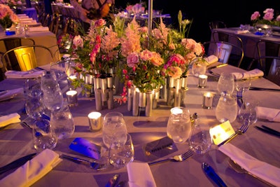 Soft pink flowers in the centerpieces contrasted the industrial materials that dominated much of the decor.