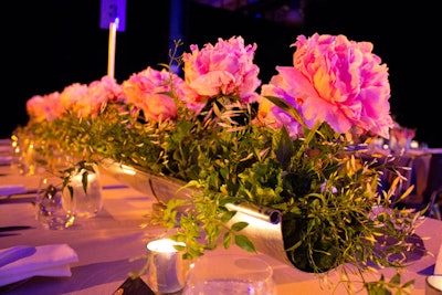 Some of the long dinner tables were decorated with giant pink peonies.