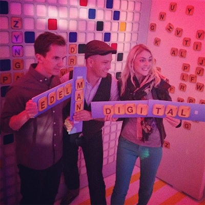 The photo booth was a take on the brand's mobile game Words With Friends, providing a branded backdrop and handheld boards that guests could customize with oversize letters.