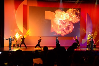 Pyrotechnic drummers—with the help of computer-generated fire—elicited a lively reaction from the audience during the show's opening number.