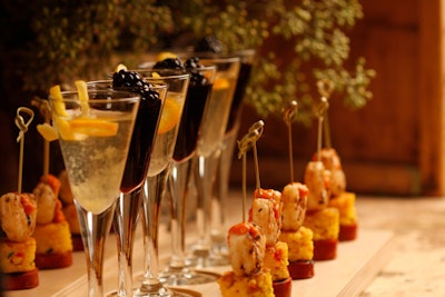 A warm-weather take on the food-and-drink pairings trend: one-bite paella skewers served with red and white sangria, by KG Fare Catering & Events in New York.