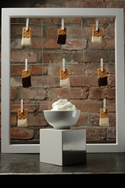 For an upscale camp-themed affair, try KG Fare Catering & Events' mess-free take on s'mores, displayed on clothespins.