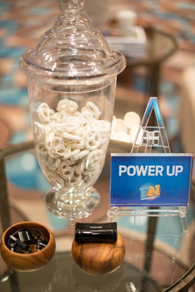 Guests could charge their smartphones in the lounge and munch on white- and yellow-colored snacks. The centerpieces during the education sessions were framed instructions on how to reference the summit on social media and log on to the hotel's Wi-Fi network.