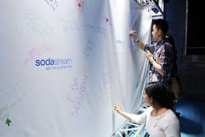 Guests could leave comments on an interactive graffiti wall marked with the SodaStream logo.