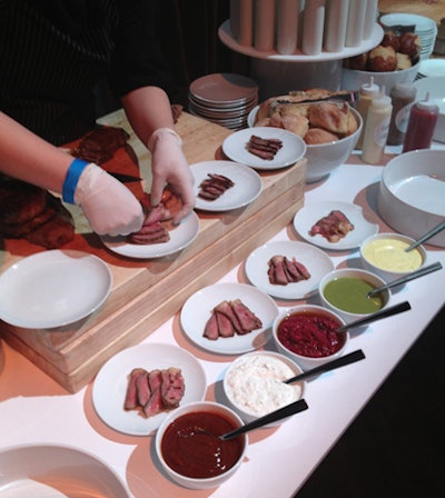 Creative Edge Parties worked with chef John DeLucie to produce the lavish food spreads.The steak-house station offered aged New York strip steak served on pretzel rolls with toppings such as horseradish-infused whipped cream and beet pesto.