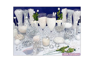White candy buffet with silver accents.