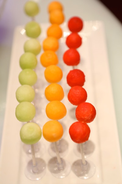 Colorful melon balls were presented like cake pops.