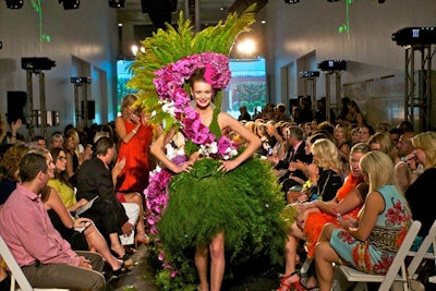 Some 30 landscape artists and floral designers created runway looks using plants, flowers, leaves, moss, and branches. H. Bloom's look (pictured) featured bright purple orchids.