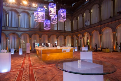 Illuminated Lucite boxes etched with maps of the world hung over the bar in the reception area. The lower rim was outlined in iconic National Geographic yellow.