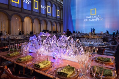 The “Land, Sea, and Sky” theme of the National Geographic flag inspired an array custom tables and toppers, including glacier ice sculptures. Syzygy Events International created the custom pieces for the event.