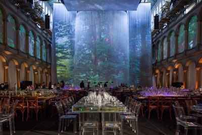 The 80-foot screen hung on a curved truss in front of the columns in the National Building Museum’s Great Hall.