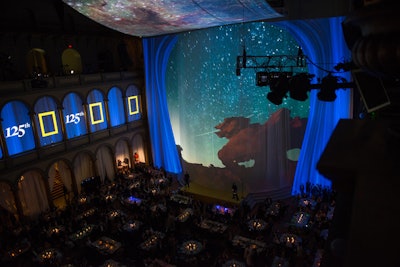 The inspiration for the massive screens originated from the opening ceremonies of the 2012 Olympic Games in London. Black-out lids were used for the gala, which had never been done before at the National Building Museum.