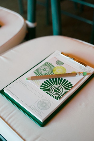 At the opening session, organizers placed custom clipboards and pencils from Gifts for the Good Life on guests' chairs. The custom-designed notepads by Trisha Hay Design included an area for attendees to jot down their 'top takeaways' from speakers.