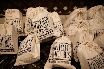 Pressed Cotton put together “Midnight Munchies” bags containing cake pops, popcorn, and cookies for guests to take with them at the end of the welcome party.